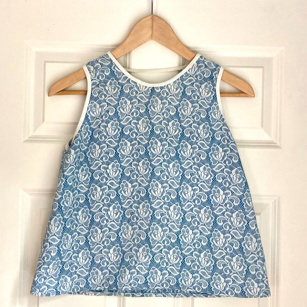 Short sleeveless girls top, white and blue print, size 12